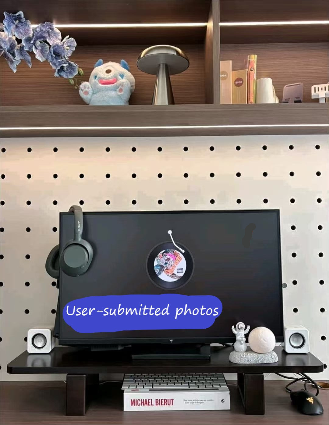 Walnut monitor riser on a wooden desk holding a laptop