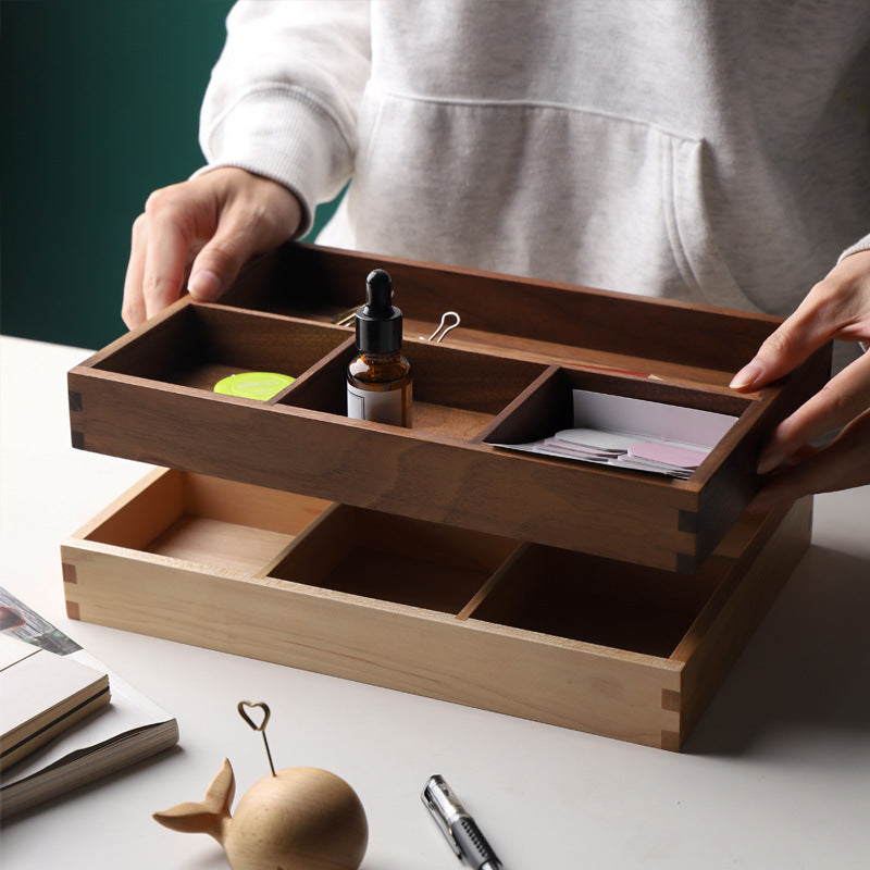 Walnut divided desk storage box holding pens and keys