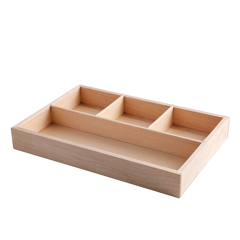 Light natural wood divided storage box with four compartments on a white background – Pausadesk