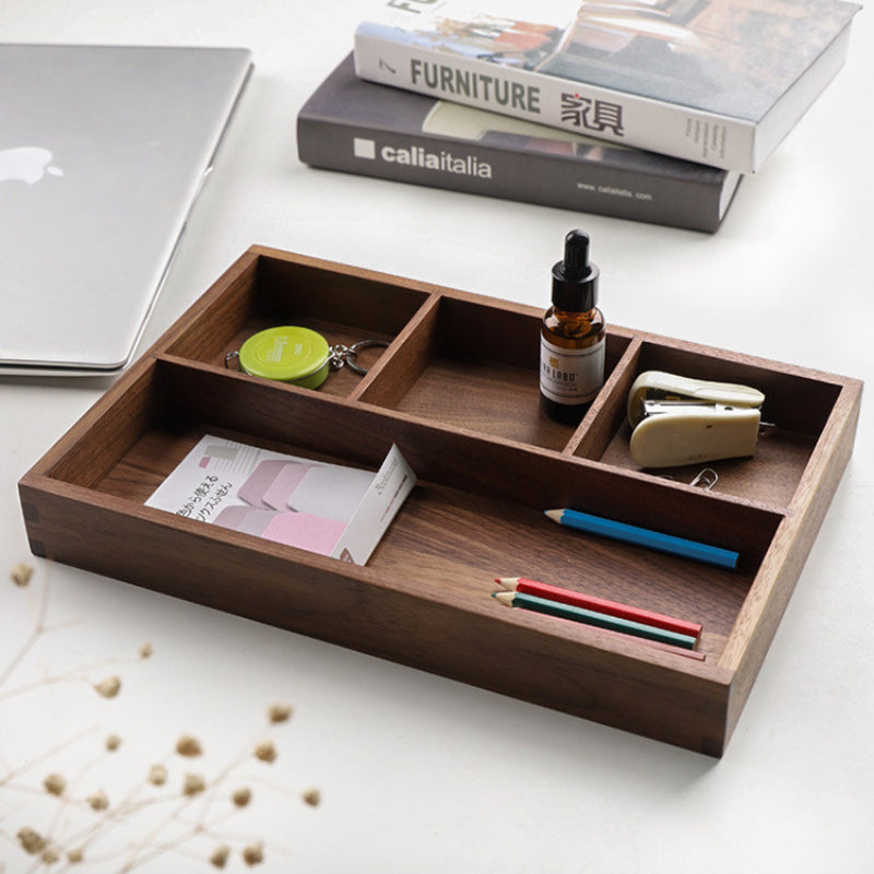 Walnut desk organizer with keys, stapler and colored pencils beside a laptop and books – Pausadesk