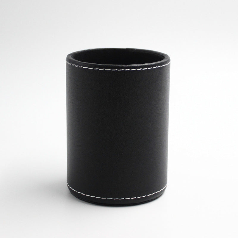 Round black leather pen cup with white stitching, front view on white background – Pausadesk