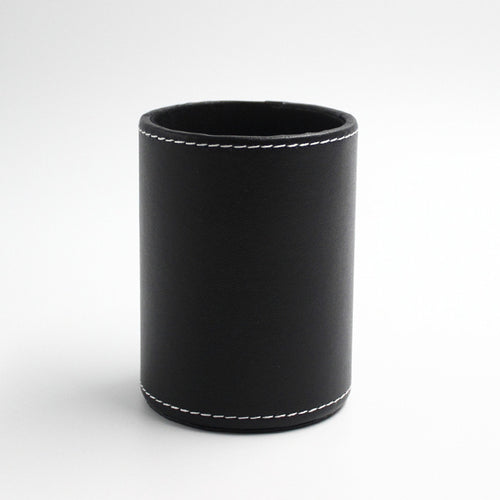 Round black leather pen cup with white stitching, front view on white background – Pausadesk
