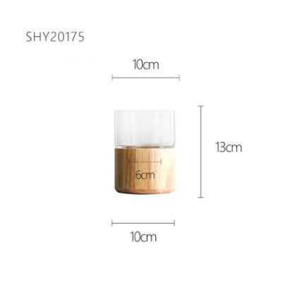 Dimension diagram of clear glass vase with light wood base, marked 12 cm diameter and 17 cm height – Pausadesk