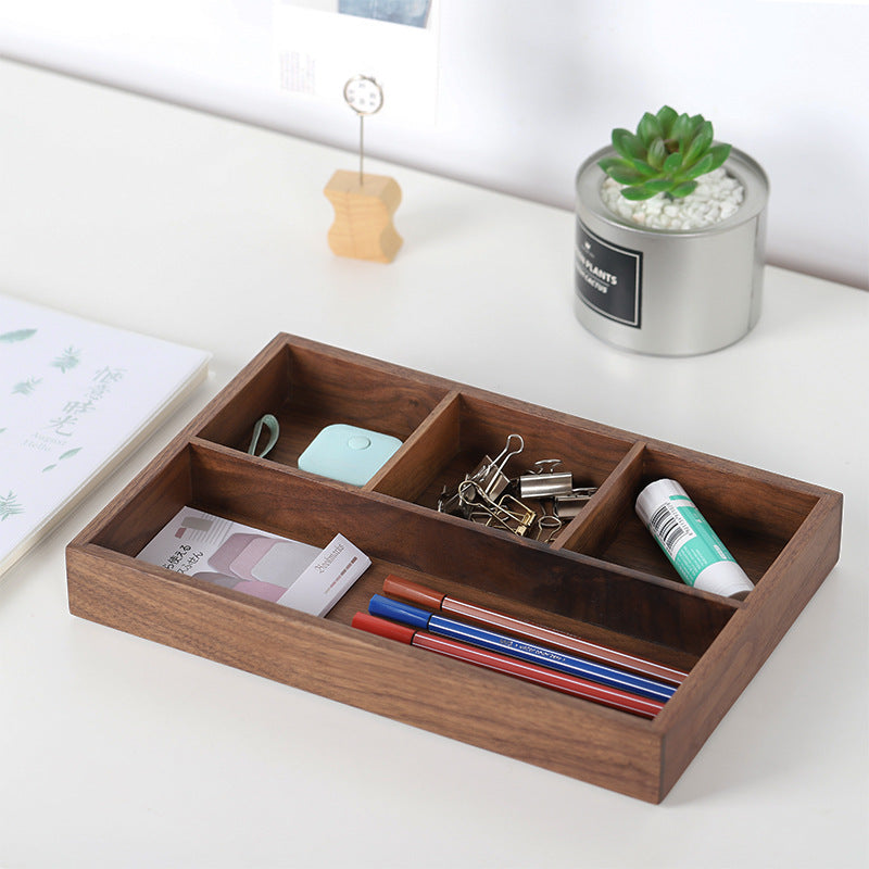 Walnut desk box holding binder clips, eraser and pens on a white desk with a succulent – Pausadesk