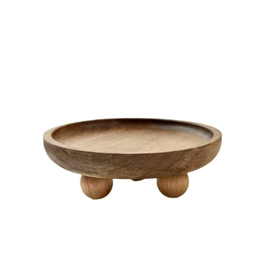Round walnut jewelry tray on small ball feet, shown empty on a white background – Pausadesk