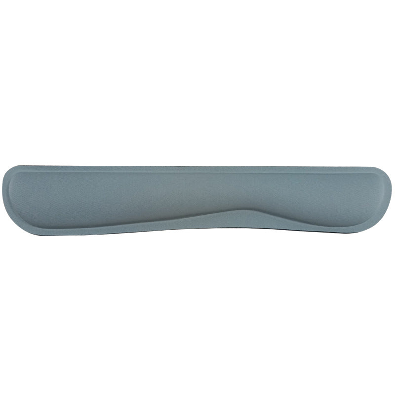 Gray memory foam keyboard wrist rest with contoured dip, front view on white background – Pausadesk